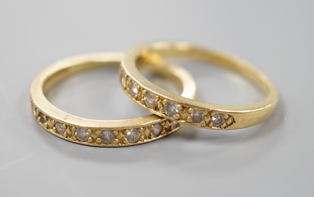 A modern pair of 18ct gold and diamond set half eternity rings, size P, gross weight 5.9 grams.